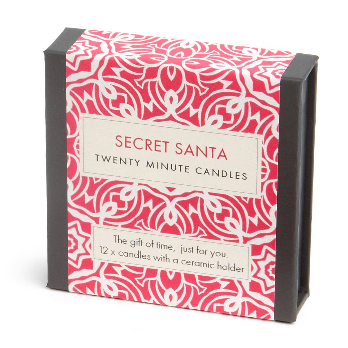 A boxed candle product labeled 'SECRET SANTA' and 'TWENTY MINUTE CANDLES' with a red-and-white ornamental pattern and black side panels, photographed on a white background.