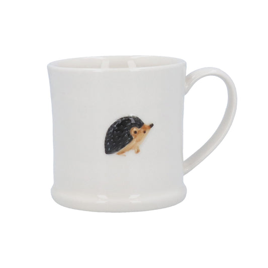 White mug with a hedgehog design on a white background