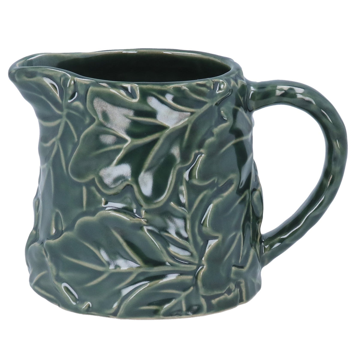 Green ceramic mug with leaf pattern on a white background