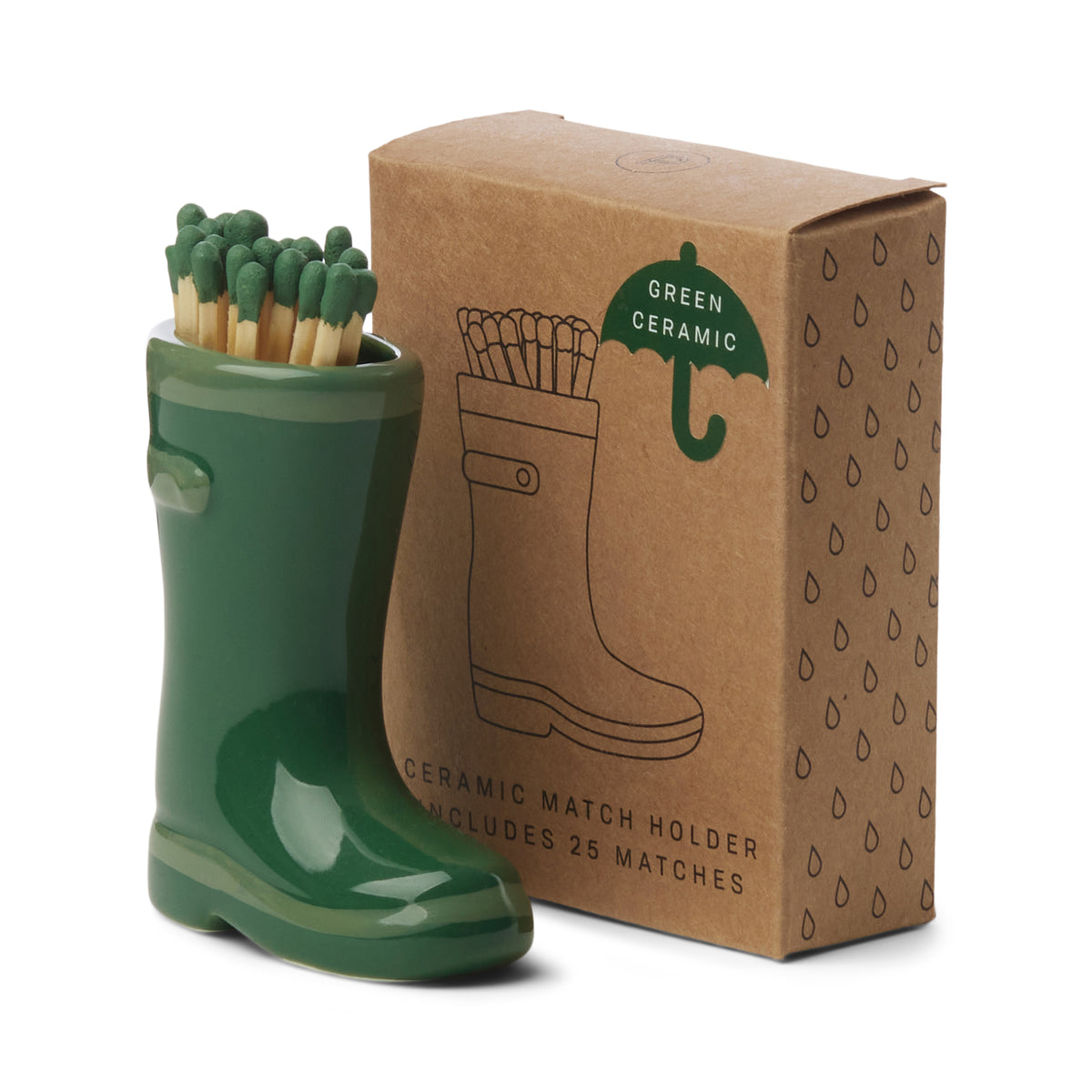 Green ceramic match holder shaped like a boot with matches, next to its packaging box.