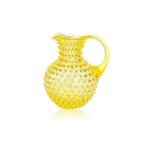 Yellow textured pitcher on a white background