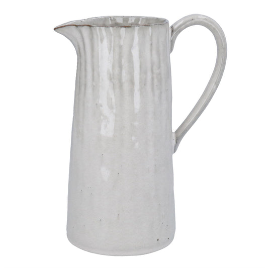 White ceramic pitcher on a white background