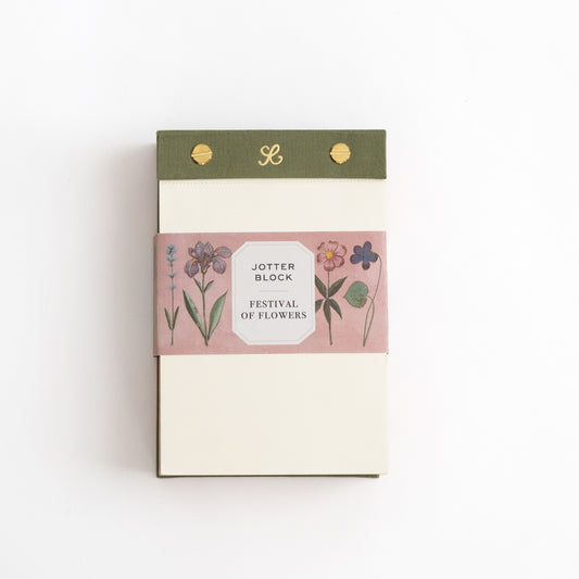 Notebook with floral design and branding on a white background